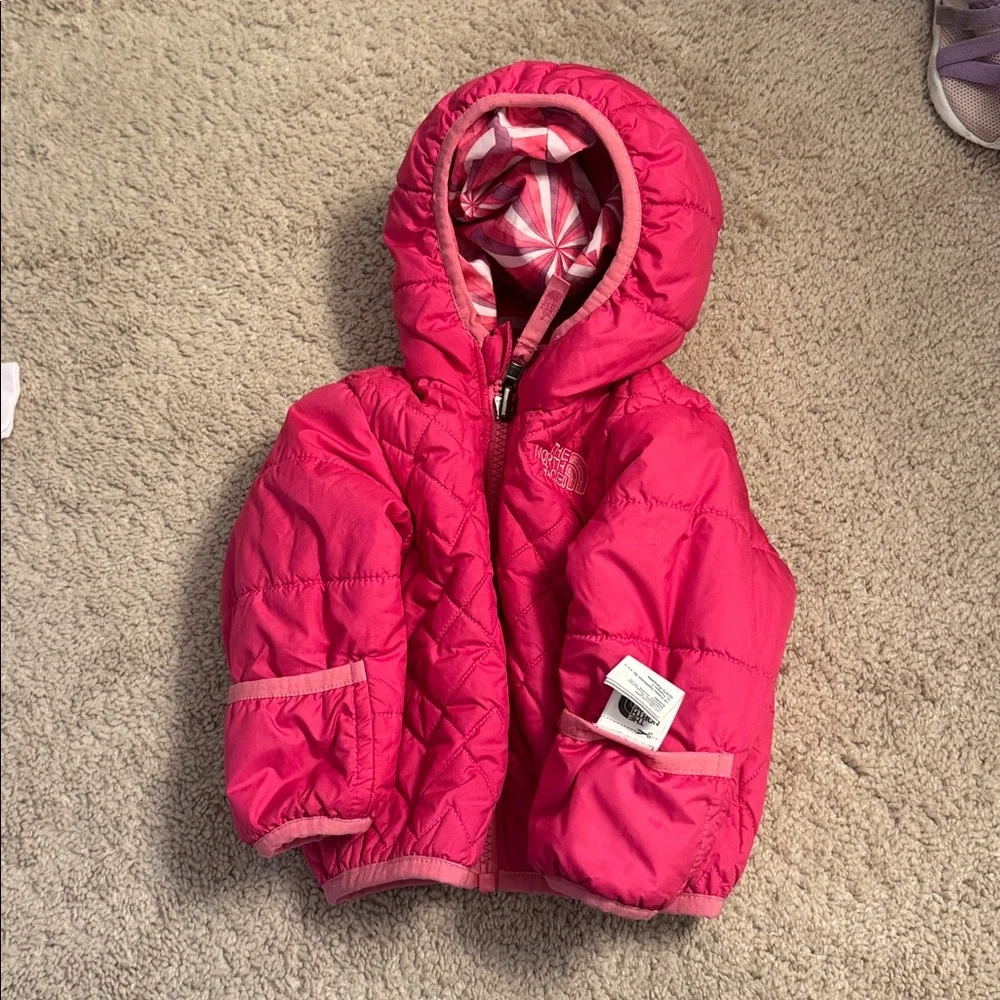 The North Face Pink Quilted Girls' Puffer Jacket with Patterned Lining